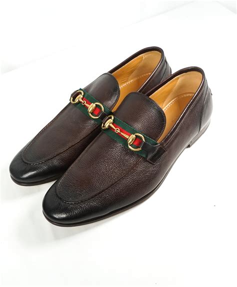 Gucci loafers with red stripe